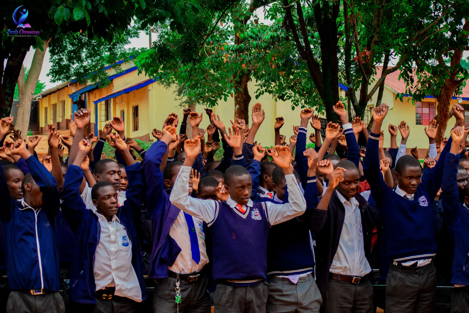 Students at Magena Boys High School raising their hands during a ZOF mentorship session